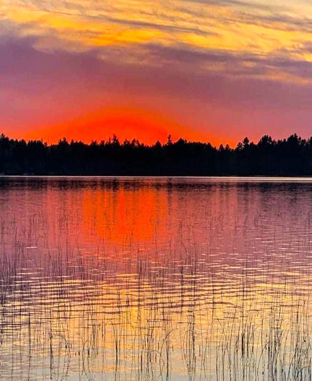 Click to enlarge - Beautiful summer sunset from Conro's Resort on Moen Lake.